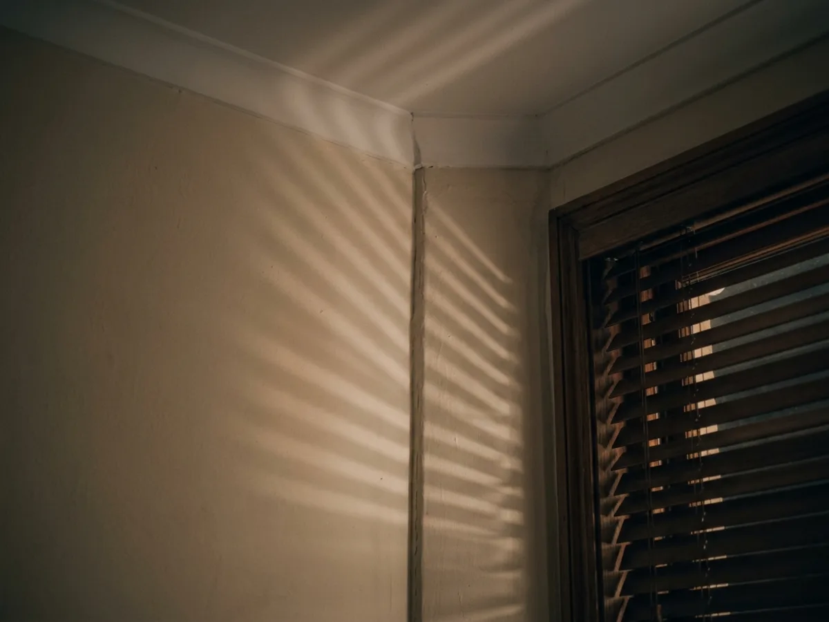 A close view of a ceiling corner at night